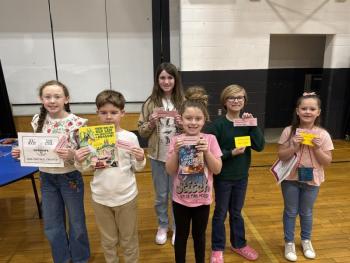 Six students show off their raffle wins