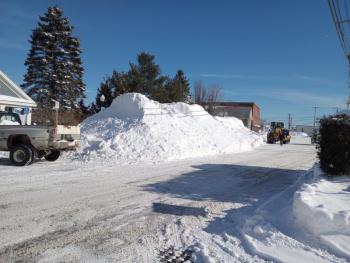 large snow pile at side of road