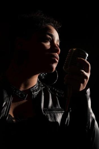 Kenya Hall close up at mic