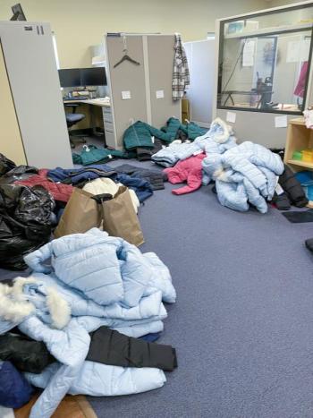 Office with piles of coats