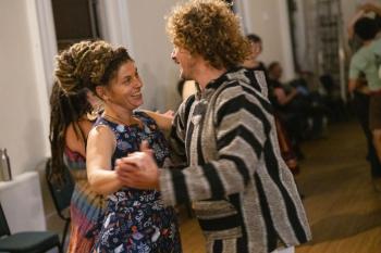 Man, woman dance together