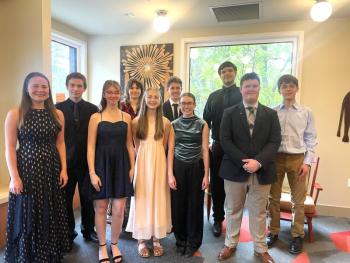 Group photo of young adults in formal attire