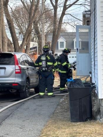 firefighters at kitchen door