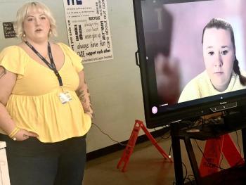 Woman in room; another female on Zoom