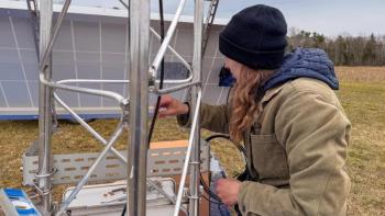 Female looks at section of weather tower