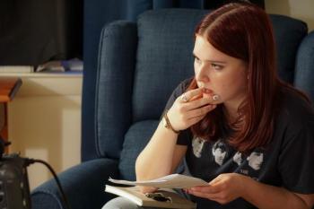 female sitting in chair