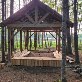 wooden structure with bench seats