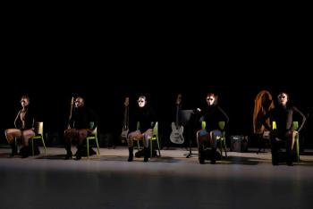 dancers seated in a row