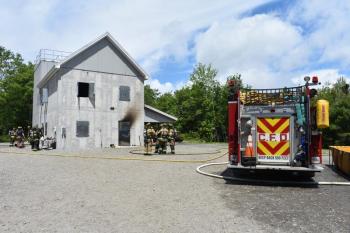 building with fire truck, water supply