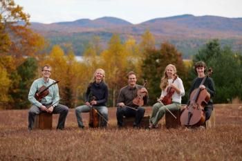 five musicians in a field