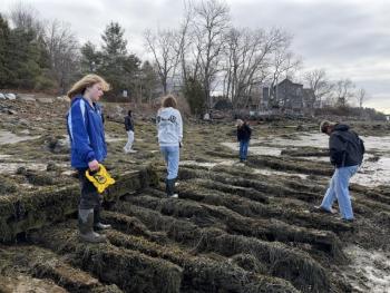 students stand on the timbers