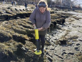 upclose picture of female student using piece of equipment