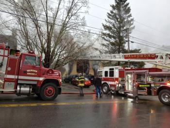 Firefighters from Warren, Waldoboro, Thomaston and Union battle an early morning fire that broke out around 6 a.m. in a downtown Warren apartment building. (Photo by Sarah Thompson)