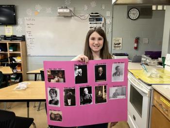Nora Smith holds picture tree 