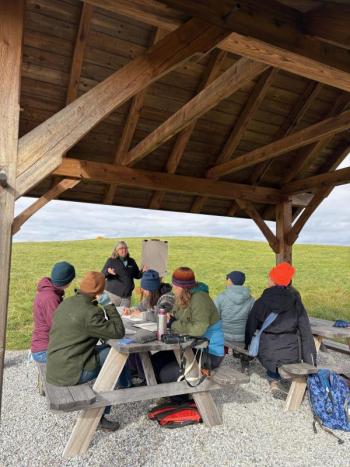 sitting at picnic tables