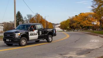 a law enforcement vehicle blocks a road.