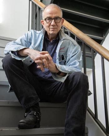 Dave Morrison seated on staircase