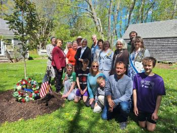 large group photo next to seedling