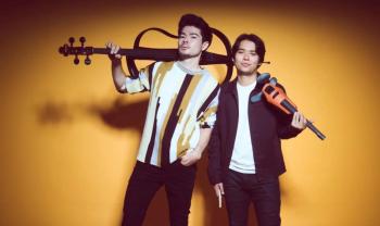 two males holding instruments