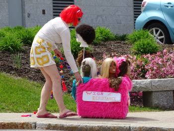 Bridget Matros moves her mini float into position. (photo by Erica Thoms)