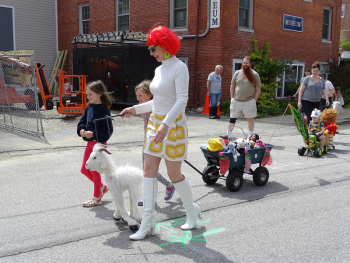 Birdget Matros, parade organizer, leads the procession. (photo by Erica Thoms)