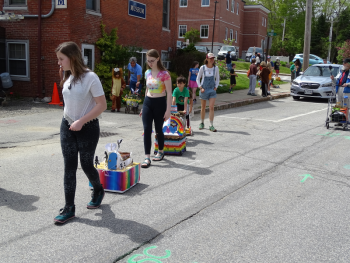 Birdget Matros, parade organizer, leads the procession. (photo by Erica Thoms)