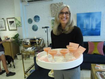 Ginger Mitchell, a family friend, serves the frosé (Photo by Kay Stephens)