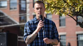 jared golden speaks during an event