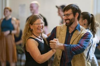 woman and man dancing together