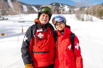 Man, teen girl ski patrollers
