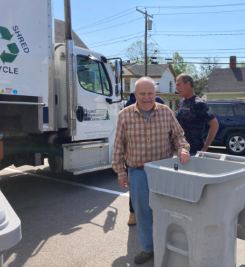 man and shred bin