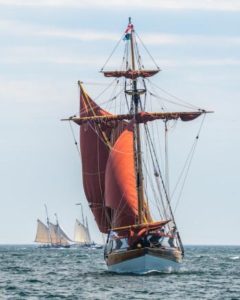 schooner with reddish sails