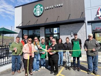 ribbon cutting in front of Starbucks