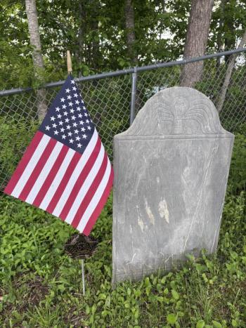 grave stone with American flag