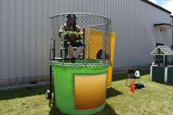 man at dunk tank seat