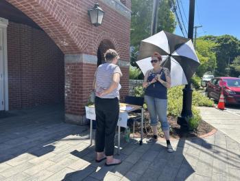 Outside the Rockport Public Library where tables are set up for advocacy efforts. 