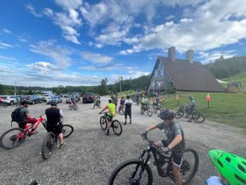 group of bike riders in the Camden Snow Bowl parking lot