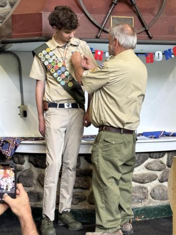 Scout receiving badge