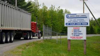 truck passing through gated entrance
