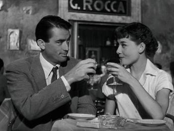 man woman have drinks at eatery