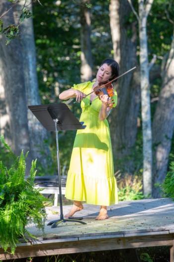 violinist in yellow dress