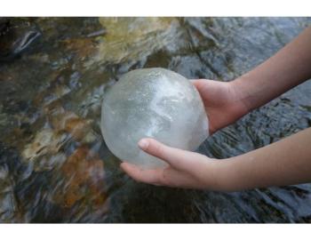 orb held above water