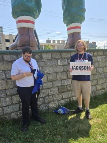 At the feet of the Paul Bunyon statue in Bangor. (Photo by Michael Hurley)