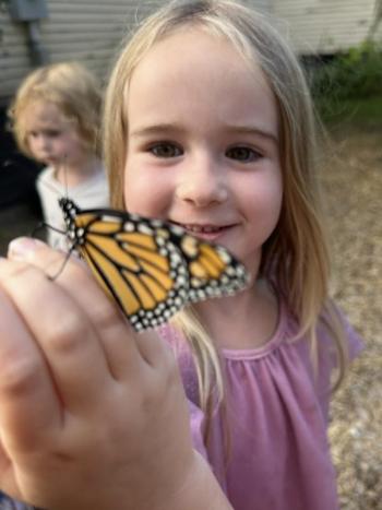 girl holding butterfly