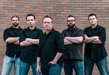 five men wearing black shirts and denim pants