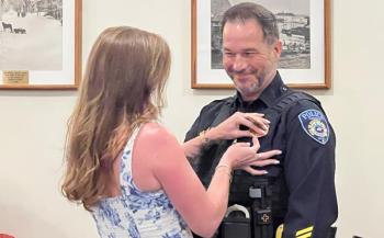Allen Weaver, Jr., Camden Police Chief, and his wife, Kimberly, who pinned his new badge to his lapel,, July 13. (Photo courtesy Holly Anderson)