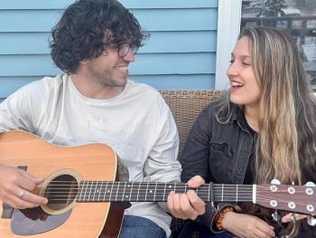 male and female with guitar