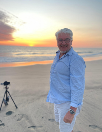 Man standing on a sandy beach