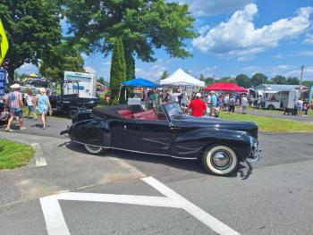OHTM black sedan