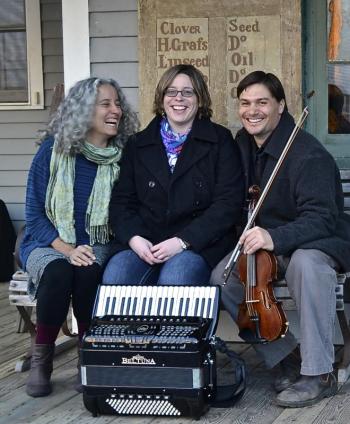 three adults pose for picture